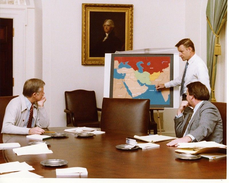 President Jimmy Carter receives a briefing about the Iran hostage crisis.